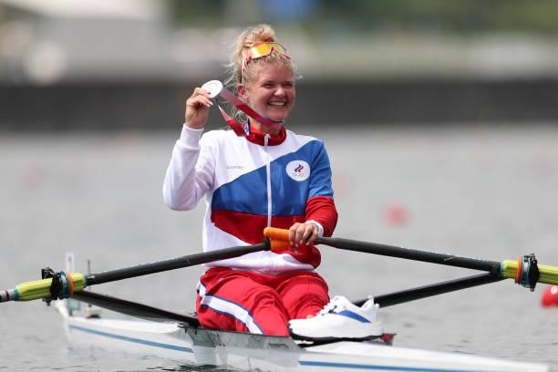 Silver medalist Hanna Prakatsen of Team ROC poses with her medal on her boat after the Women's Single Sculls Final A on day seven of the Tokyo 2020...