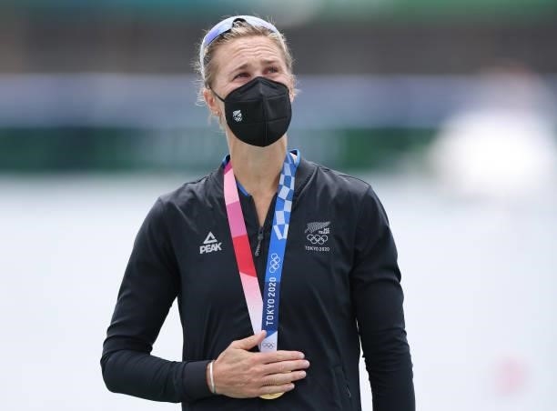 Gold medalist Emma Twigg of Team New Zealand looks on after receiving her medal during the medal ceremony for the Women's Single Sculls Final A on...