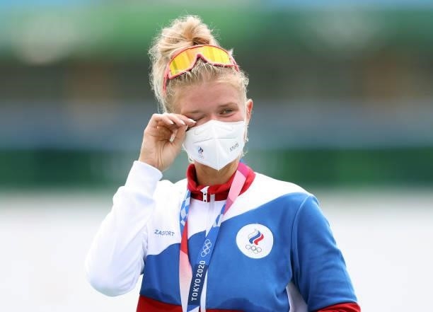Silver medalist Hanna Prakatsen of Team ROC reacts after receiving her medal during the medal ceremony for the Women's Single Sculls Final A on day...