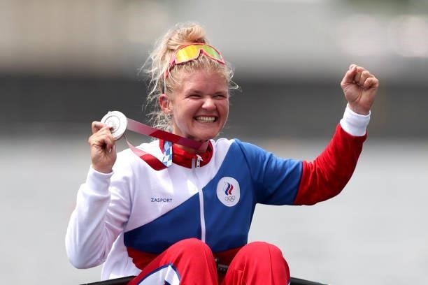 Silver medalist Hanna Prakatsen of Team ROC poses with her medal on her boat after the Women's Single Sculls Final A on day seven of the Tokyo 2020...