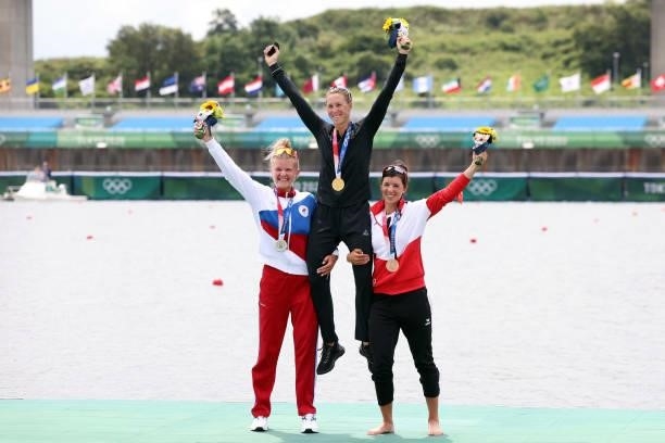 Silver medalist Hanna Prakatsen of Team ROC, gold medalist Emma Twigg of Team New Zealand and bronze medalist Magdalena Lobnig of Team Austria pose...