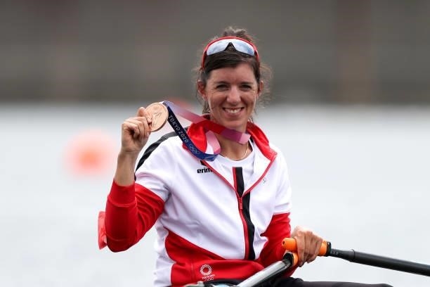 Bronze medalist Magdalena Lobnig of Team Austria poses with her medal on her boat after the Women's Single Sculls Final A on day seven of the Tokyo...