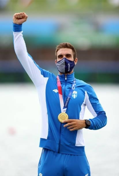 Gold medalist Stefanos Ntouskos of Team Greece poses with his medal during the medal ceremony for the Men's Single Sculls Final A on day seven of the...