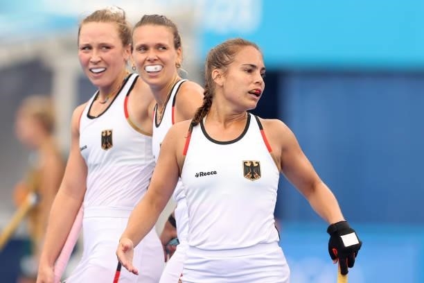 Lisa Altenburg of Team Germany celebrates scoring the third goal with teammates during the Women's Preliminary Pool A match between South Africa and...
