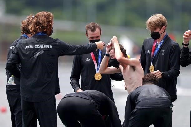 Sam Bosworth of Team New Zealand is tossed into the water by his teammates after winning the gold medal in the Men's Eight Final A on day seven of...