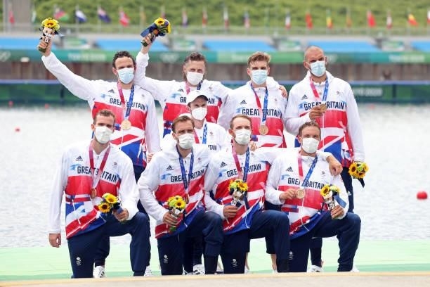 Team Great Britain pose with their bronze medals during the medal ceremony for the Men's Eight Final A on day seven of the Tokyo 2020 Olympic Games...