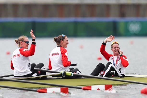 Gold medalists Sydney Payne, Avalon Wasteneys and Kristen Kit of Team Canada pose with their medals on their boat after the Women's Eight Final A on...