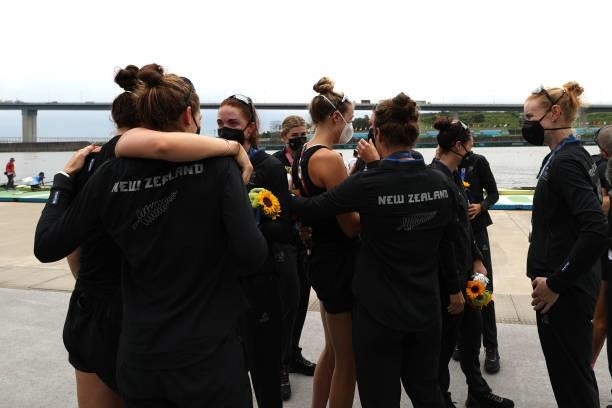 Team New Zealand talk to each other after winning the silver medal during the Women's Eight Final A on day seven of the Tokyo 2020 Olympic Games at...