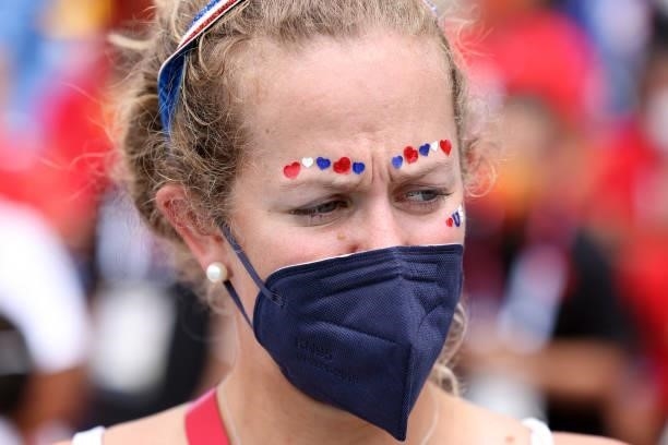 Member of Team United States decorates her face in support of her teammates during session eight of Rowing on day seven of the Tokyo 2020 Olympic...