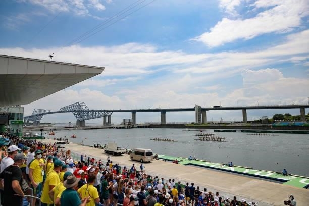 People watch as athletes compete during the Women's Eight Final A on day seven of the Tokyo 2020 Olympic Games at Sea Forest Waterway on July 30,...