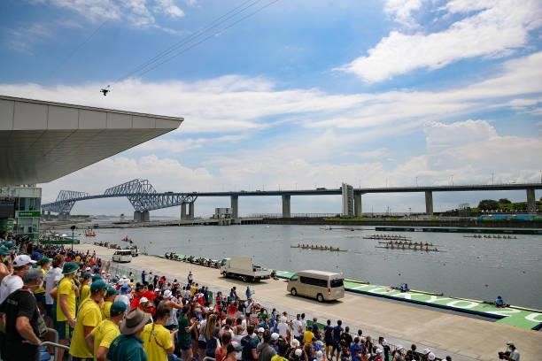 People watch as athletes compete during the Women's Eight Final A on day seven of the Tokyo 2020 Olympic Games at Sea Forest Waterway on July 30,...