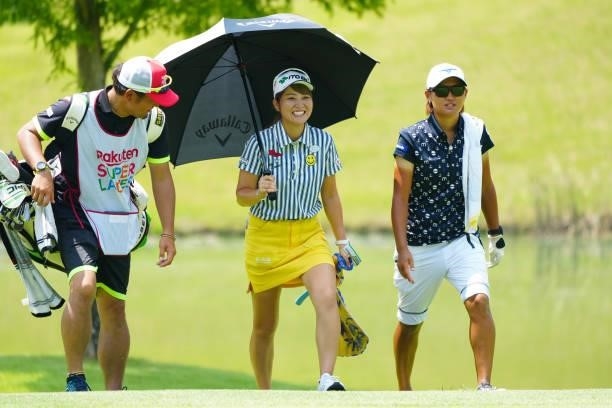Hikari Tanabe and Mao Nozawa of Japan are seen on the 8th green during the second round of Rakuten Super Ladies at Tokyu Grand Oak Golf Club on July...