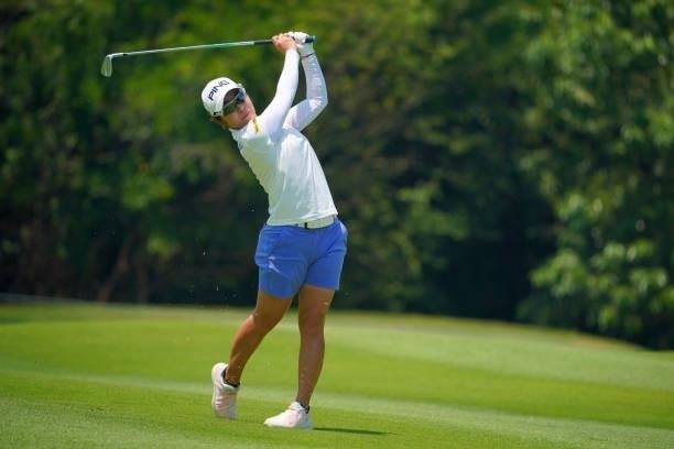 Mamiko Higa of Japan hits her second shot on the 2nd hole during the second round of Rakuten Super Ladies at Tokyu Grand Oak Golf Club on July 30,...