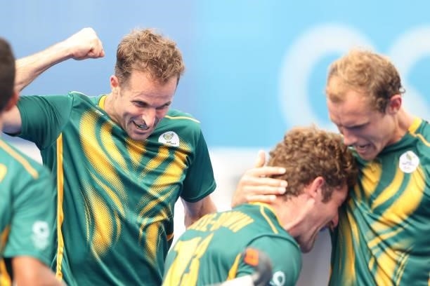 Matthew Guise-Brown of Team South Africa celebrates scoring the third goal with teammates during the Men's Preliminary Pool A match between Canada...