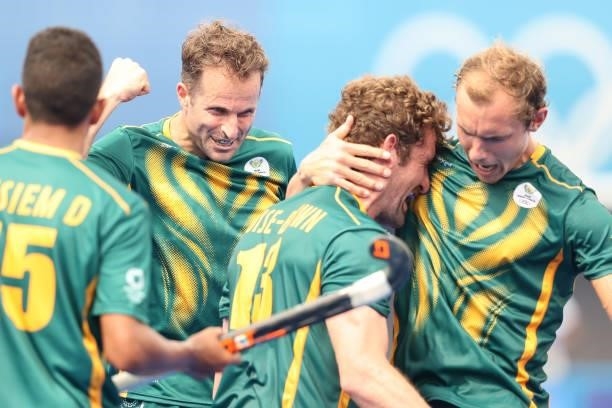 Matthew Guise-Brown of Team South Africa celebrates scoring the third goal with teammates during the Men's Preliminary Pool A match between Canada...