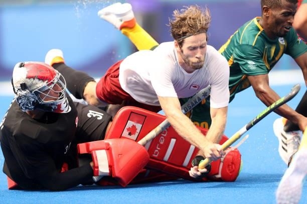 Antoni Pawel Kindler and James Alexander Paget Kirkpatrick of Team Canada defend the goal during the Men's Preliminary Pool A match between Canada...