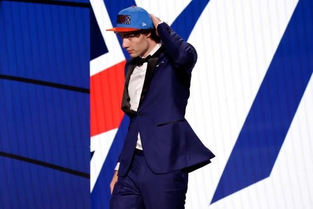 Josh Giddy walks across the stage after being drafted by the Oklahoma City Thunder during the 2021 NBA Draft at the Barclays Center on July 29, 2021...
