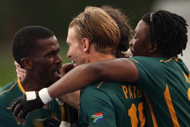 Samkelo Mvimbi of Team South Africa celebrates scoring the fourth goal with Taine Paton and teammates during the Men's Preliminary Pool A match...
