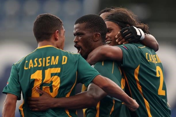 Samkelo Mvimbi of Team South Africa celebrates scoring the fourth goal with Abdud Dayaan Cassiem and Mustaphaa Cassiem during the Men's Preliminary...