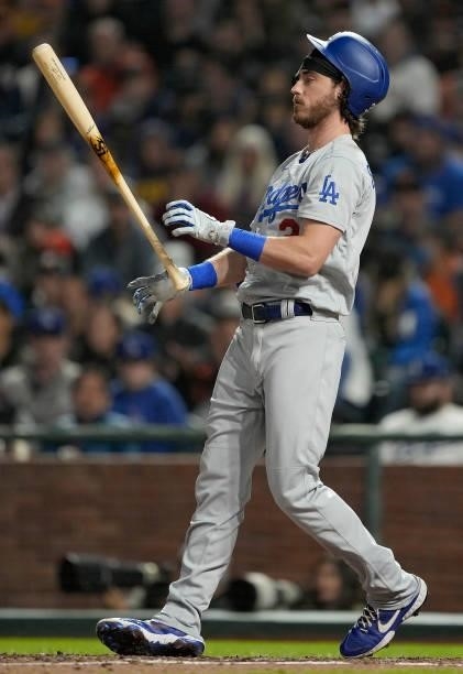 Cody Bellinger of the Los Angeles Dodgers reacts tossing his bat in the air after striking out against the San Francisco Giants in the top of the six...