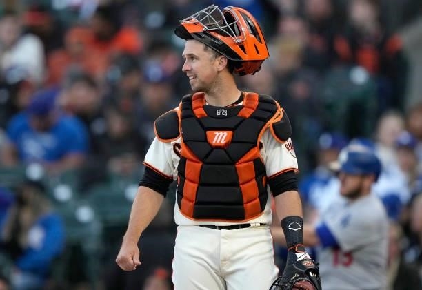 Buster Posey of the San Francisco Giants looks on from his position against the Los Angeles Dodgers in the top of the third inning at Oracle Park on...