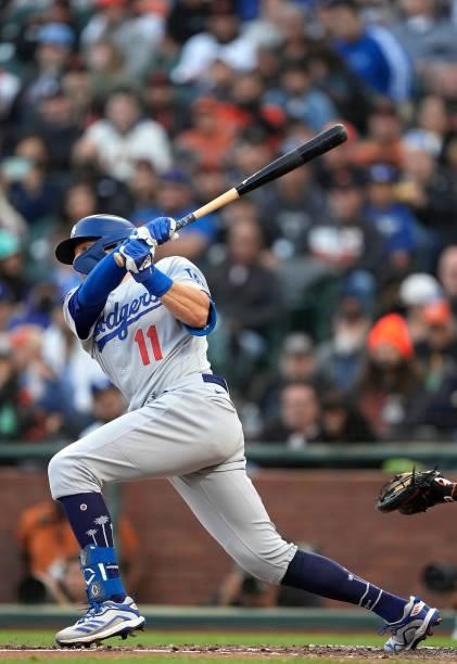 Pollock of the Los Angeles Dodgers hits an RBI single scoring Will Smith against the San Francisco Giants in the top of the third inning at Oracle...
