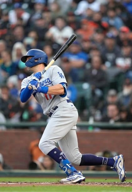 Pollock of the Los Angeles Dodgers hits an RBI single scoring Will Smith against the San Francisco Giants in the top of the third inning at Oracle...