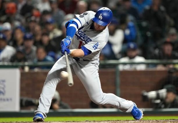 Max Muncy of the Los Angeles Dodgers hits a two-run RBI double against the San Francisco Giants in the top of the seventh inning at Oracle Park on...