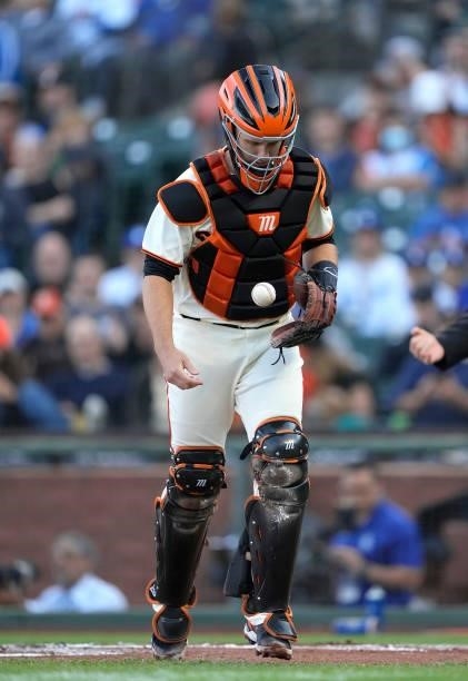 Buster Posey of the San Francisco Giants heads back to the dugout at the end of the top of the first inning against the Los Angeles Dodgers at Oracle...