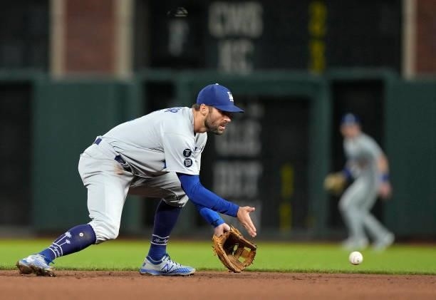 Chris Taylor of the Los Angeles Dodgers goes down to field a ground ball off the bat of Jason Vosler of the San Francisco Giants in the bottom of the...