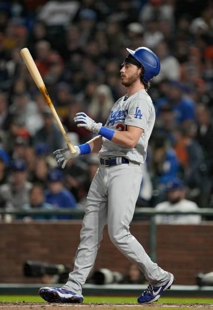 Cody Bellinger of the Los Angeles Dodgers reacts tossing his bat in the air after striking out against the San Francisco Giants in the top of the six...