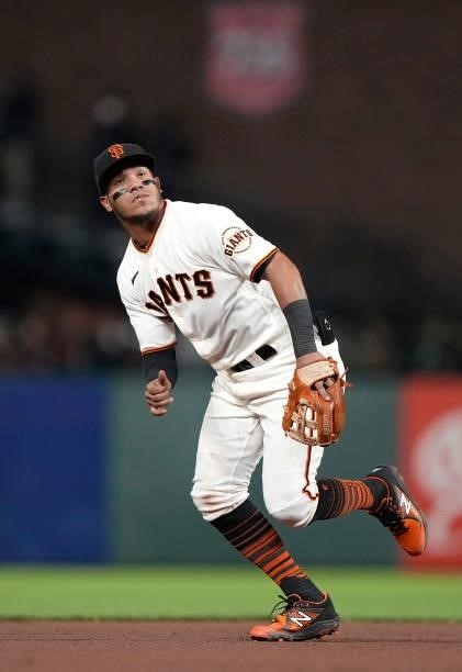 Thairo Estrada of the San Francisco Giants reacts to the ball off the bat against the Los Angeles Dodgers in the top of the seventh inning at Oracle...