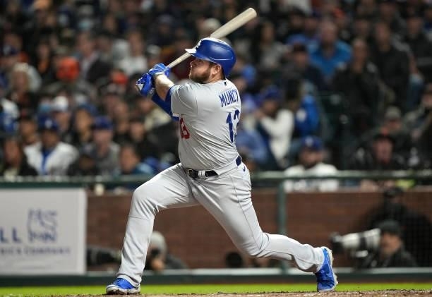 Max Muncy of the Los Angeles Dodgers hits a two-run RBI double against the San Francisco Giants in the top of the seventh inning at Oracle Park on...