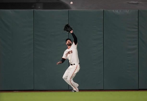 Steven Duggar of the San Francisco Giants catches a fly ball off the bat of Justin Turner of the Los Angeles Dodgers in the top of the seventh inning...