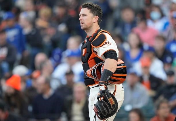 Buster Posey of the San Francisco Giants looks on from his position against the Los Angeles Dodgers in the top of the third inning at Oracle Park on...