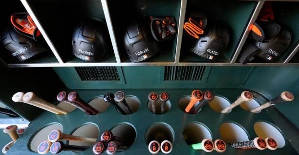 Detailed view of bats and helmets belonging the the San Francisco Giants players seen in racks prior to the game against the Los Angeles Dodgers at...