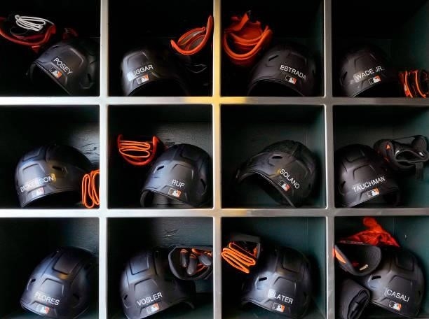 Detailed view of batting helmets belonging the the San Francisco Giants players seen in racks prior to the game against the Los Angeles Dodgers at...