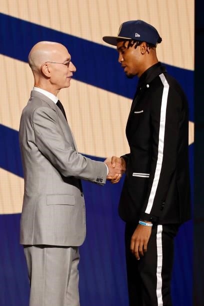 Commissioner Adam Silver and Ziaire Williams shake hands after Williams was drafted by the New Orleans Pelicans during the 2021 NBA Draft at the...