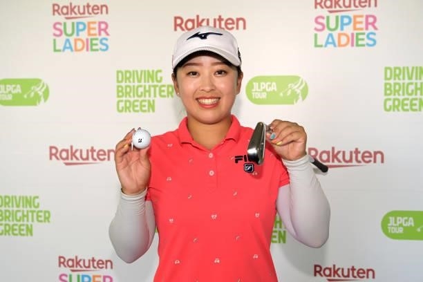 Mao Saigo of Japan poses after making a hole-in-one on 17th hole following the second round of Rakuten Super Ladies at Tokyu Grand Oak Golf Club on...