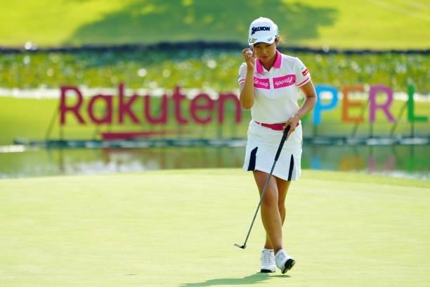 Nana Suganuma of Japan acknowledges fans after holing out on the 18th green during the second round of Rakuten Super Ladies at Tokyu Grand Oak Golf...