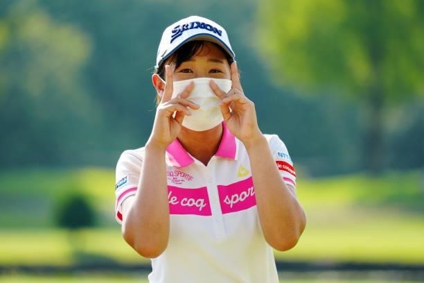 Nana Suganuma of Japan poses after holing out on the 18th green during the second round of Rakuten Super Ladies at Tokyu Grand Oak Golf Club on July...