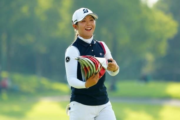 Yuri Yoshida of Japan smiles after holing out on the 18th green during the second round of Rakuten Super Ladies at Tokyu Grand Oak Golf Club on July...