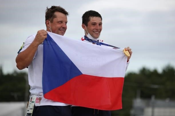 Gold medalist Jiri Prskavec of Team Czech Republic celebrates with a team member at the medal ceremony following the Men's Kayak Slalom Final on day...