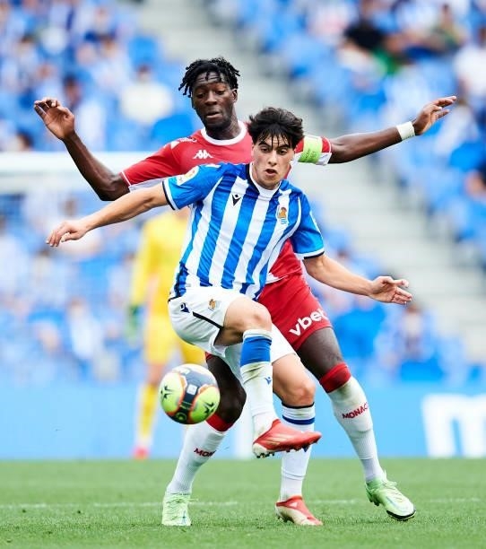 Julen Lobete of Real Sociedad duels for the ball with Axel Disasi of AS Monaco during the Friendly Match between Real Sociedad and As Monaco at Reale...