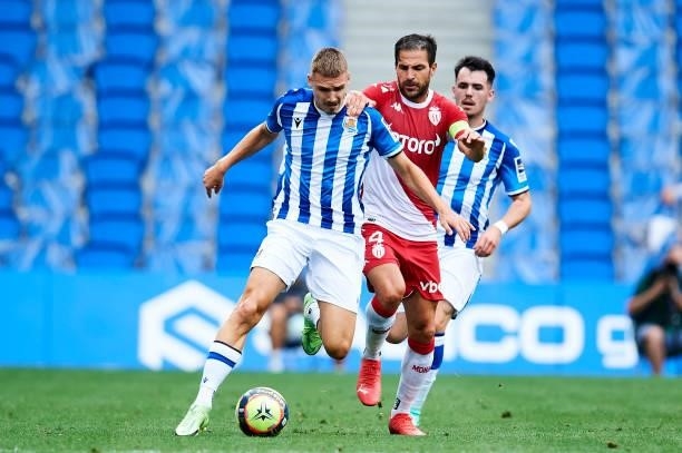 Peter Pokorny of Real Sociedad duels for the ball with Cesc Fabregas of AS Monaco during the Friendly Match between Real Sociedad and As Monaco at...