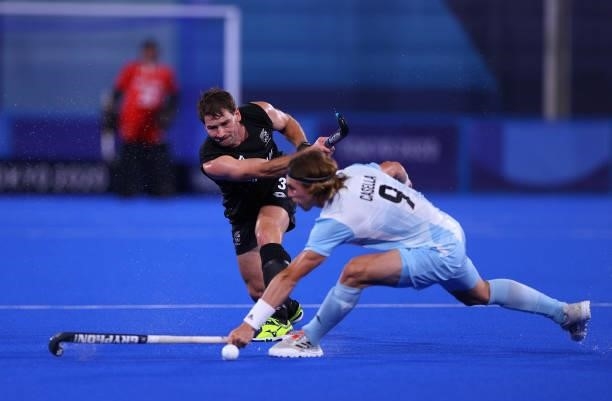 Maico Casella Schuth of Team Argentina attempts to block as David Brydon of Team New Zealand passes the ball during the Men's Preliminary Pool A...