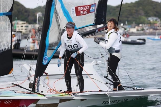 Victoria Travascio and Maria Sol Branz of Team Argentina react after winning race 8 of the Women's Skiff 49er class on day seven of the Tokyo 2020...