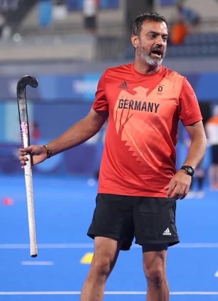 Kais al Saadi, Head Coach of Team Germany warms up prior to the Men's Preliminary Pool B match between Germany and Netherlands on day seven of the...