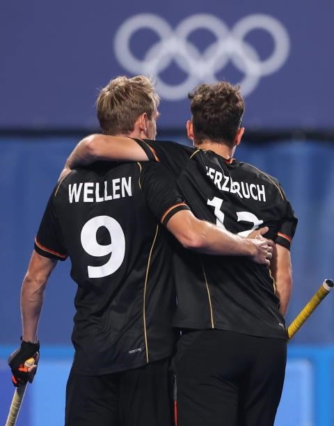Niklas Wellen of Team Germany celebrates with teammate Timm Alexander Herzbruch after scoring their team's first goal during the Men's Preliminary...