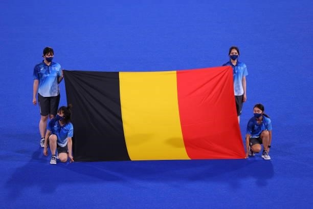Flag bearers hold the flag of Team Belgium ahead of the Men's Preliminary Pool B match between Belgium and Great Britain on day seven of the Tokyo...